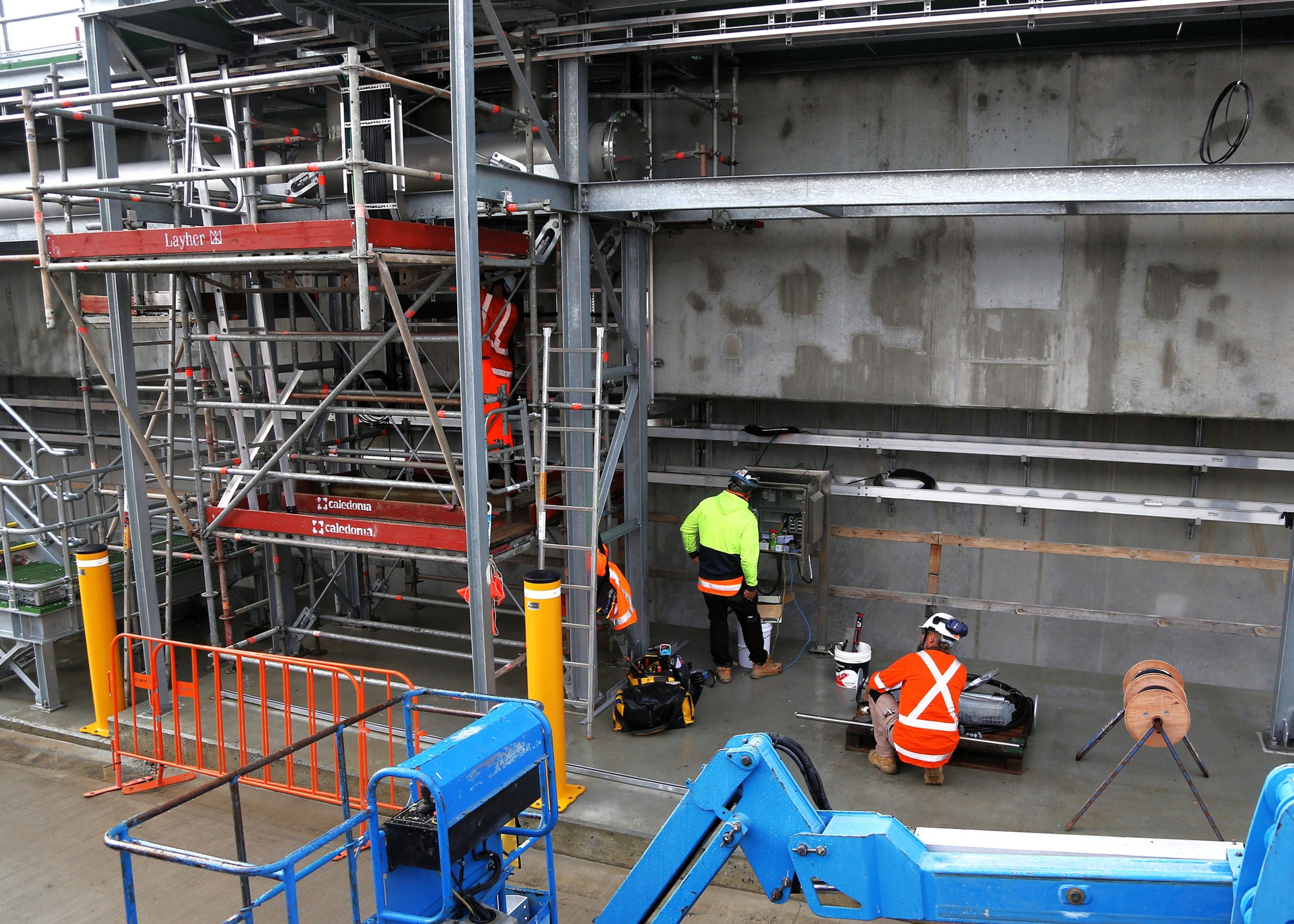 Construction site with workers and safety equipment
