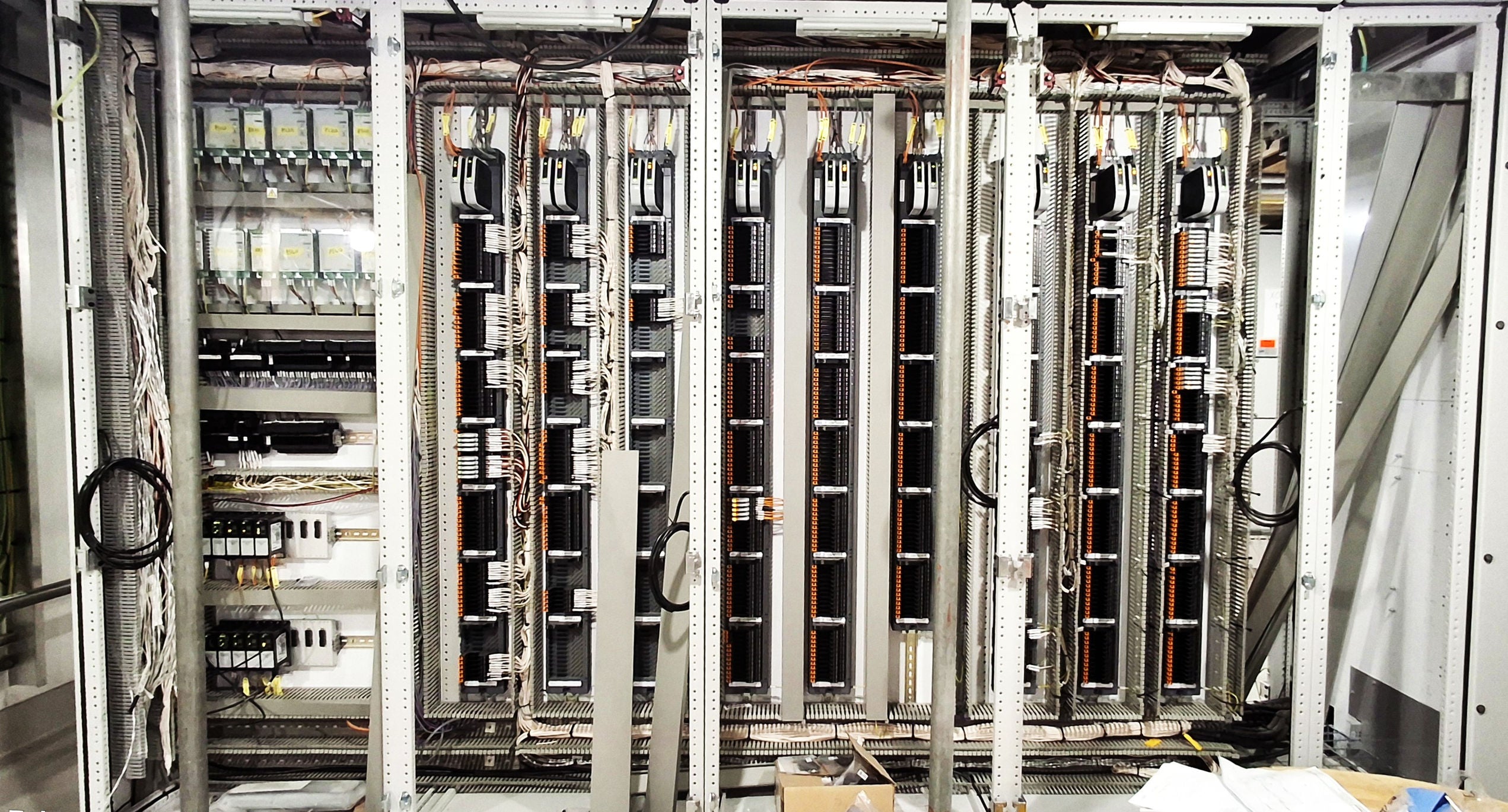 Row of server racks in a data center setting